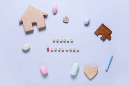 Text SPEECH THERAPIST with chalks and figures on light background