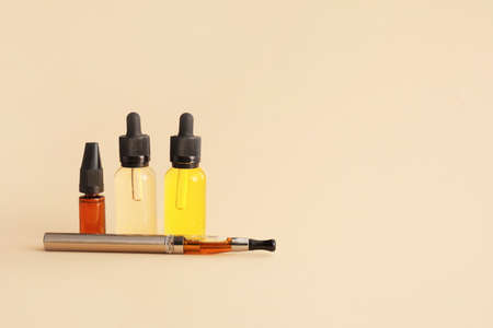 Electronic cigarette with oil on light backgroundの写真素材