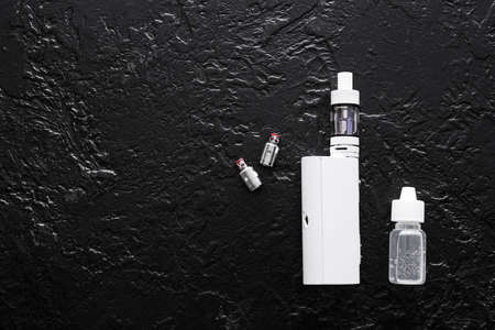 Vape mod with oil on dark background
