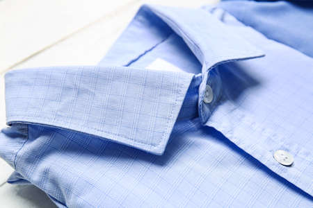 Stylish male shirt on light wooden background, closeupの写真素材