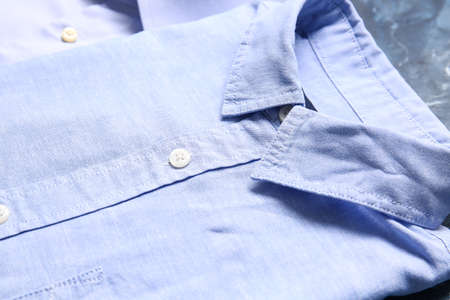Stylish male shirt on color background, closeup