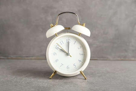 Stylish alarm clock on grunge backgroundの写真素材
