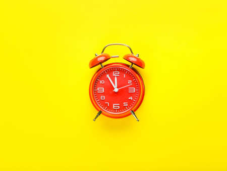 Stylish alarm clock on color background