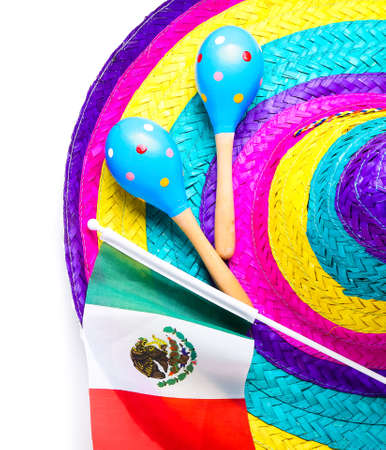 Mexican flag, sombrero and maracas on white background