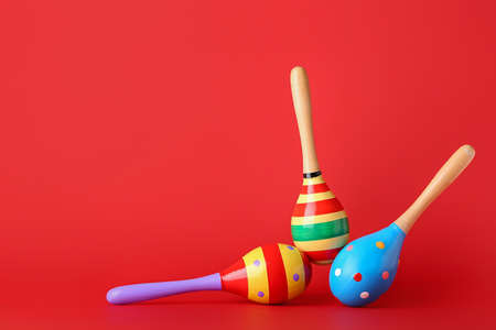 Mexican maracas on color background
