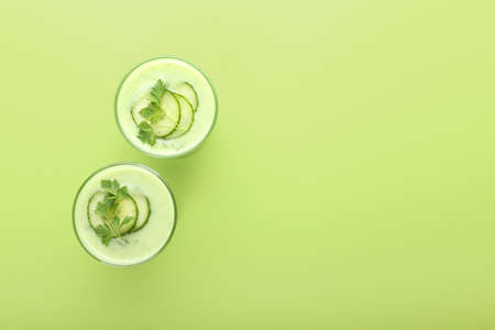 Glasses with green gazpacho on color backgroundの写真素材