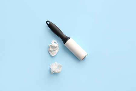Lint roller on color background