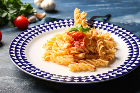 Plate with healthy pasta on color backgroundの写真素材