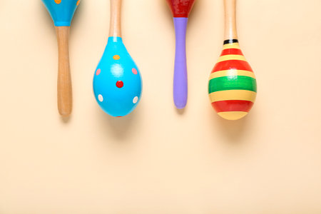 Mexican maracas on color background