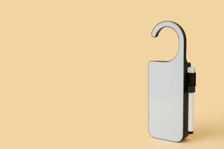 Modern door hanger with marker on color background