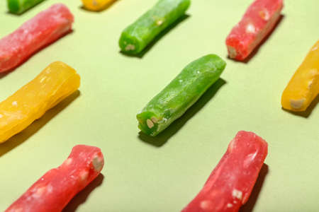 Tasty Turkish delight on color background