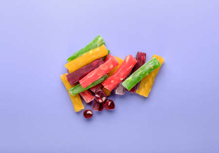 Tasty Turkish delight on color background