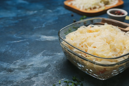 Bowl with tasty sauerkraut on color backgroundの写真素材