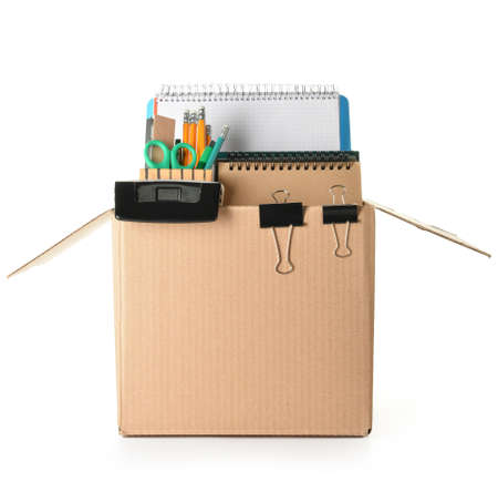 Box with personal stuff on white background. Concept of dismissal