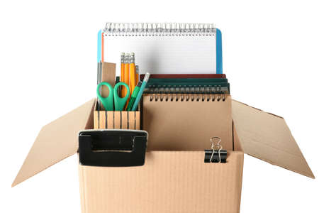 Box with personal stuff on white background. Concept of dismissal