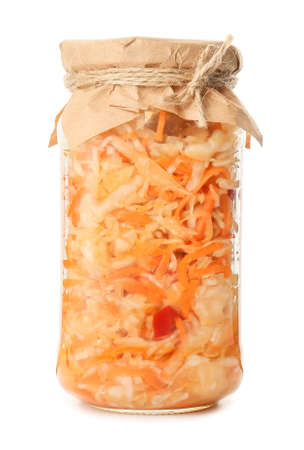 Glass jar with tasty sauerkraut on white backgroundの写真素材