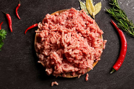 Composition with fresh forcemeat on dark background