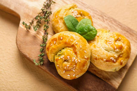 Puff pastry stuffed with spinach on color backgroundの写真素材