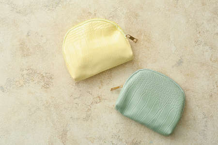 Cosmetic bags on light background