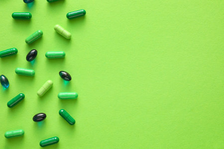 Different pills on green backgroundの写真素材