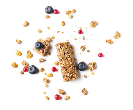 Delicious cereal bar and berries on white backgroundの写真素材