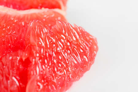 Tasty grapefruit piece on light background, closeup