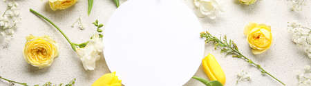 Blank card with beautiful fresh flowers on light backgroundの写真素材