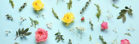 Beautiful fresh flowers on blue background