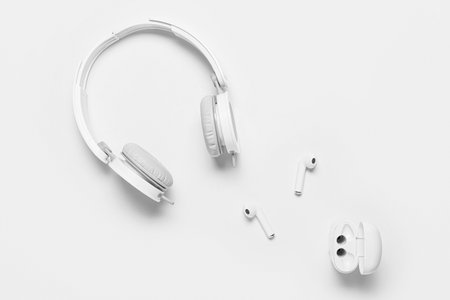Modern headphones and earphones on white backgroundの写真素材