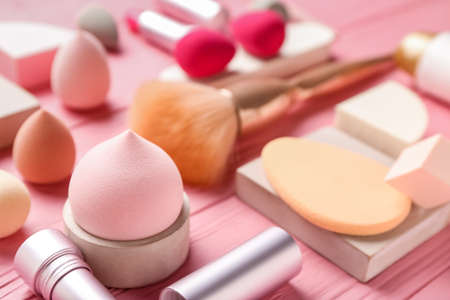 Different makeup sponges on color wooden background, closeupの写真素材