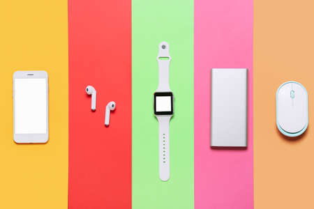 Set of modern gadgets on color backgroundの写真素材