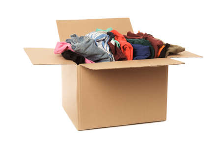 Wardrobe box with clothes on white background