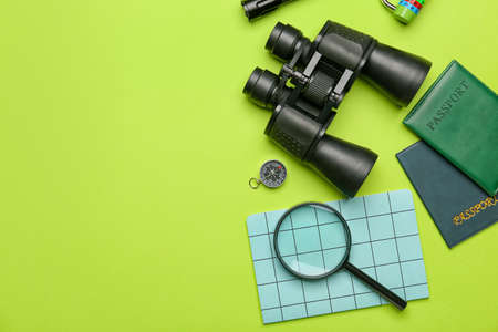 Composition with travel items, documents and notebook on green backgroundの写真素材