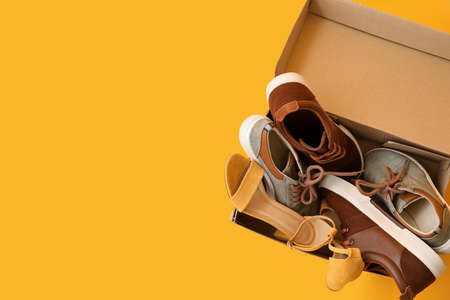 Wardrobe box with shoes on color backgroundの写真素材