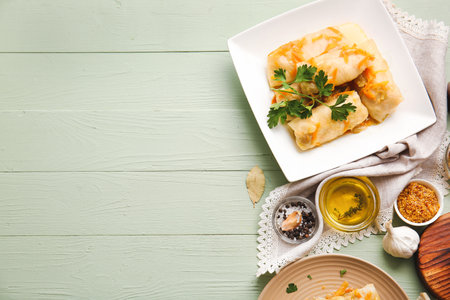 Plates with tasty stuffed cabbage rolls on color wooden backgroundの写真素材
