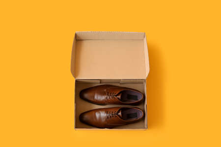 Wardrobe box with shoes on color backgroundの写真素材