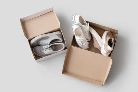 Wardrobe box with shoes on light background