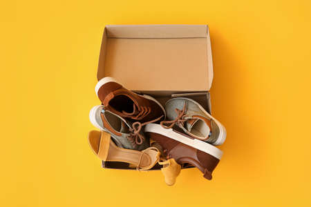Wardrobe box with shoes on color backgroundの写真素材