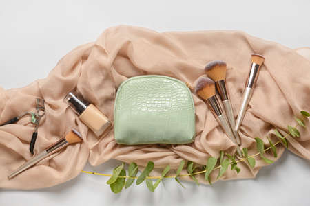 Stylish bag and decorative cosmetics on light backgroundの写真素材