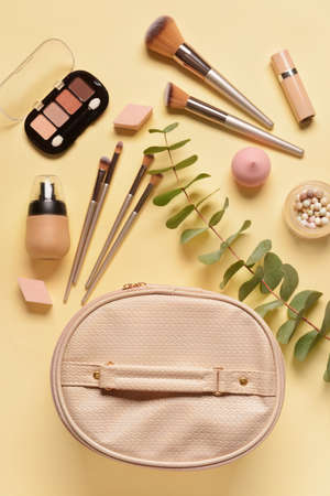 Stylish bag and decorative cosmetics on color backgroundの写真素材