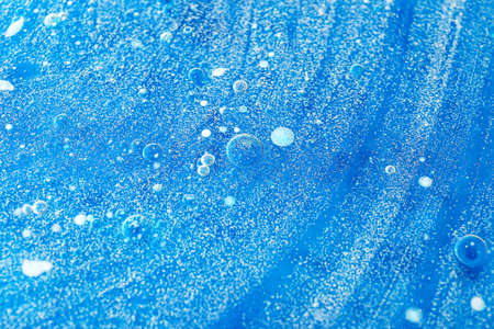 Solid water bubbles on blue backgroundの写真素材