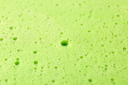 Texture of green thick foam, closeup