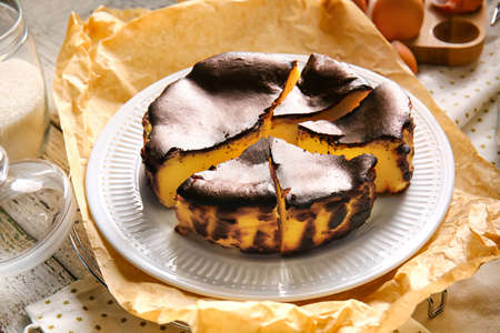 Tasty Basque burnt cheesecake on table