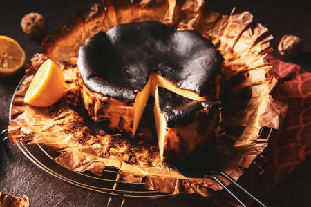 Tasty Basque burnt cheesecake on dark backgroundの写真素材