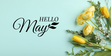 Beautiful flowers with text HELLO MAY on blue backgroundの写真素材