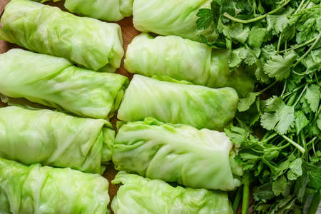 Uncooked cabbage rolls as background, closeupの写真素材