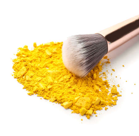Makeup brush and loose eye shadow on white backgroundの写真素材