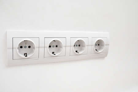 electric socket on light wall