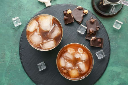 Composition with glasses of tasty iced coffee on color background