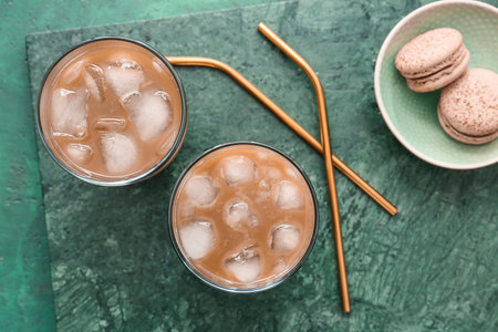 Composition with glasses of tasty iced coffee on color background